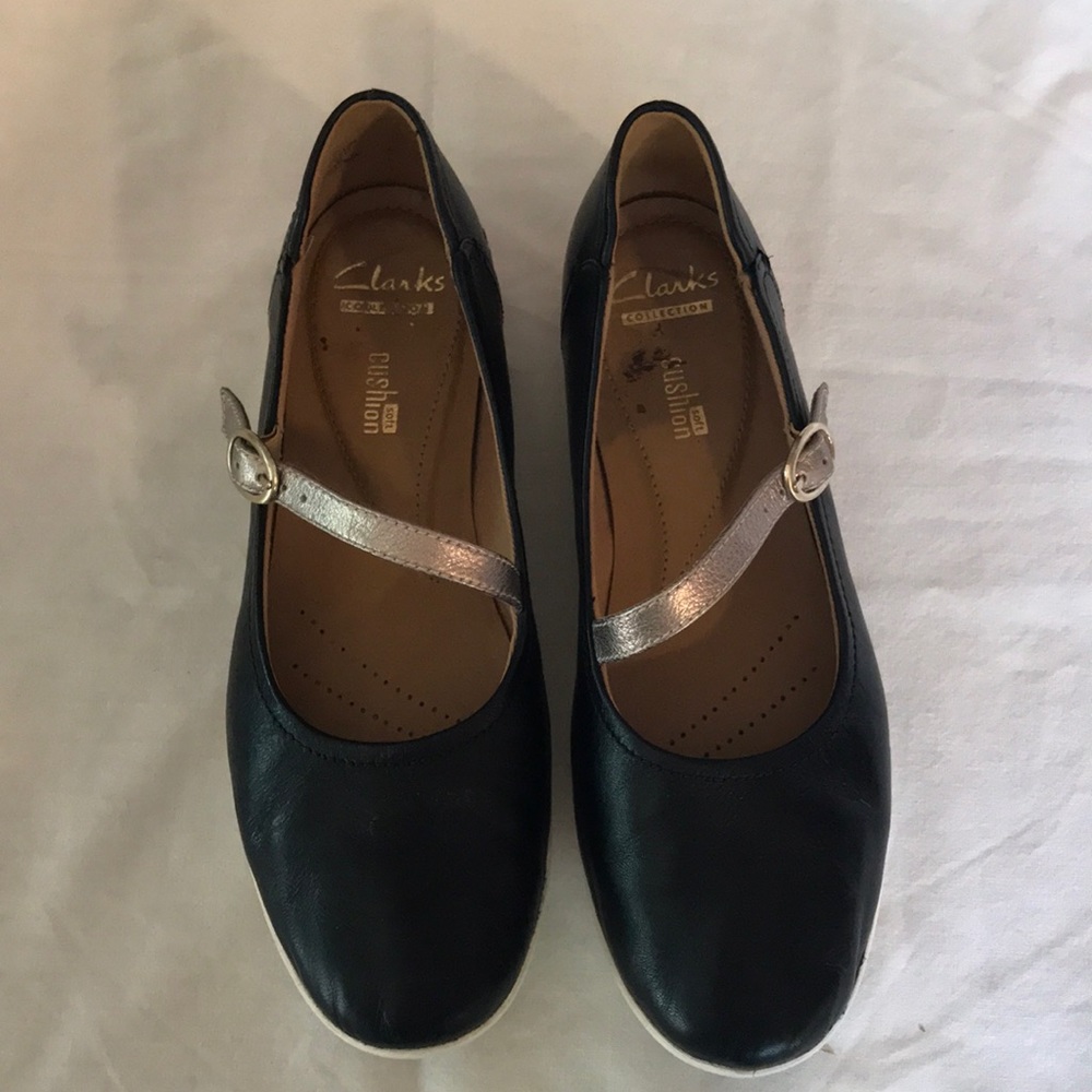 Black with gold buckled strap slip ons